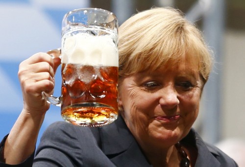 German Chancellor and top candidate for the Christian Democratic Union (CDU) Merkel toasts with beer after her speech during an electoral rally in Dachau
