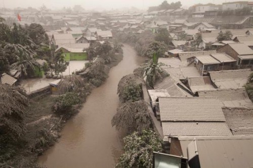 A housing complex is seen covered with ash from Mount Kelud, in Yogyakarta