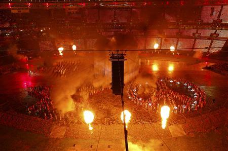 Performers take part in the opening ceremony of the London 2012 Olympic Games at the Olympic Stadium