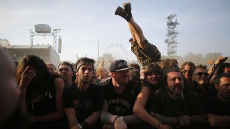 Festival-goers react during the Hellfest music Festival in Clisson