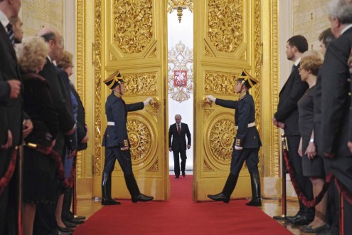 Vladimir Putin walks in as he attends the inauguration ceremony at the Kremlin in Moscow