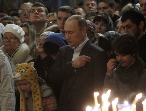 Vladimir Putin attends the Orthodox Christmas service