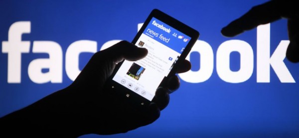 A smartphone user shows the Facebook application on his phone in Zenica, in this photo illustration