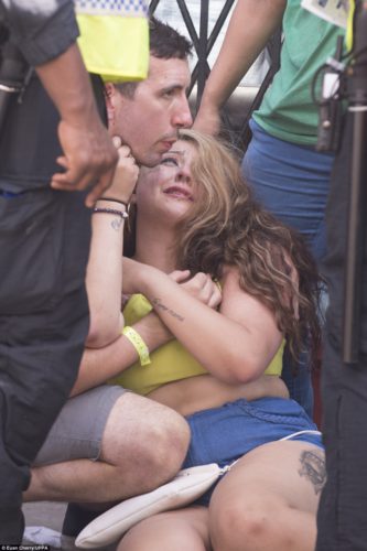 A young women collapsed and was attended by police at the annual Notting Hill Carnival in West London yesterday