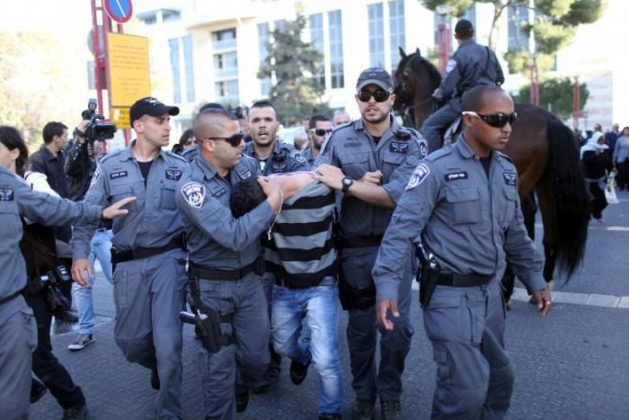 Israeli occupation soldiers abducting a Palestinian child, file, November 20, 2015 pic