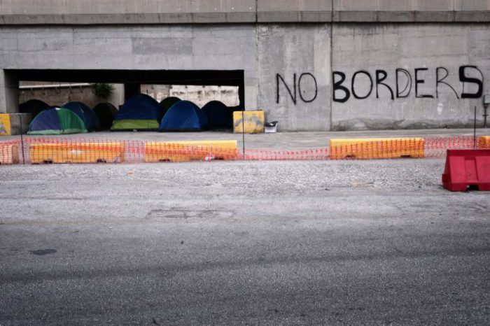 A photo taken on May 18, 2016 shows tents of migrants and refugees staged under a bridge at the Piraeus port where some 1500 migrants and refugees live in a makeshift camps on passenger areas. Greece must regulate and improve conditions for thousands of migrants -- many of them children -- detained in camps for weeks as they wait for asylum under a sketchy EU-Turkey deal, a UN human rights official said on May 16, 2016. There are over 54,000 people on Greek territory, including some 45,000 migrants who arrived before the EU-Turkey deal took effect and were stuck after other Balkan countries began closing their borders in mid-February. / AFP / LOUISA GOULIAMAKI (Photo credit should read LOUISA GOULIAMAKI/AFP/Getty Images)