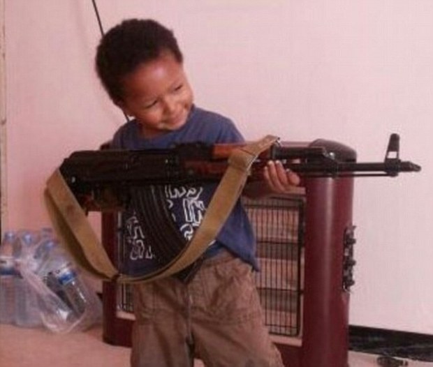 Khadijah Dare's young son poses with an AK-47rifle. This is a story that begins in the streets of Lewisham and ends in the heat of the Syrian desert, on the front line of the holy war for an Islamic caliphate. Among the British Muslims living in Syria and Iraq alongside terrorist super-group Isis, one figure has attracted particular attention recently Ñ a mysterious woman using the Twitter name Muhajirah fi Sham (meaning Òimmigrant in SyriaÓ), posting pictures of her young son holding a AK-47. She has described witnessing the execution of a young ÒrapistÓ in the Syrian town where she lives with her fighter husband and has called on Londoners to join her.