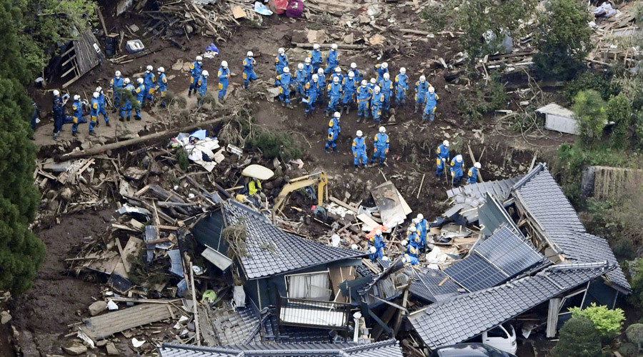 Rescue workers conduct a search and rescue operation to a collapsed house at a landslide site caused by earthquakes in Minamiaso town, Kumamoto prefecture. © Kyodo