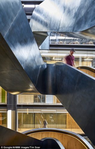 The 11-storey building at 6 Pancras Square includes oak and steel staircases which 'encourage chance encounters between colleagues for collaborative chats'