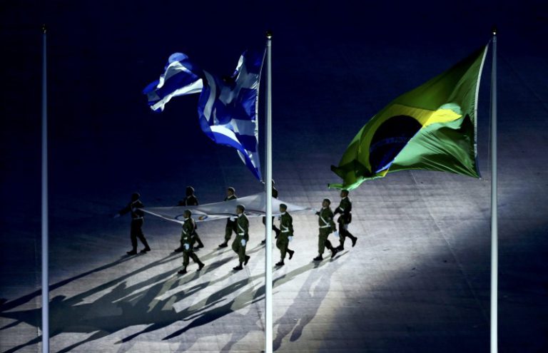 2016 Rio Olympics - Closing ceremony - Maracana - Rio de Janeiro, Brazil - 21/08/2016. The Olympic flag is carried past the Greek and Brazilian flags during the closing ceremony. REUTERS/Vasily Fedosenko FOR EDITORIAL USE ONLY. NOT FOR SALE FOR MARKETING OR ADVERTISING CAMPAIGNS.