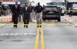 New York Mayor Bill de Blasio and New York Governor Andrew Cuomo survey the site of an explosion which occurred Saturday night in the Chelsea neighborhood of New York, U.S., September 18, 2016. REUTERS/Rashid Umar Abbasi