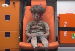 A screenshot from a handout video made available on Aug. 18, 2016 by Syrian activist group Aleppo Media Center (AMC) shows a 4-year-old boy with a bloodied face sitting in an ambulance after a house was destroyed in an airstrike on Aug. 17, 2016 in Aleppo, Syria. Eight people, including five children, are said to have been killed in the attack. (Aleppo Media Center/DPA/ZUMA Press) ORG XMIT: 1188817